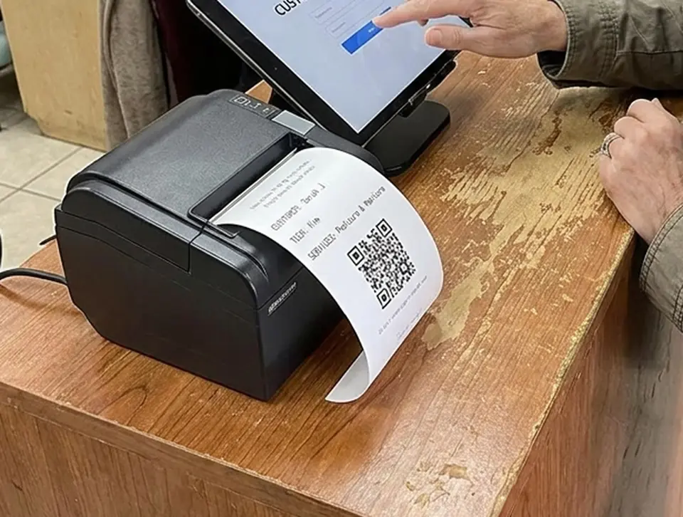 Printed nail salon check-in receipt with a QR code, customer name, technician and requested services